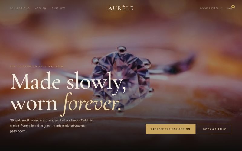 Aurèle fine jewellery website with a large serif headline over a macro photo of a diamond ring